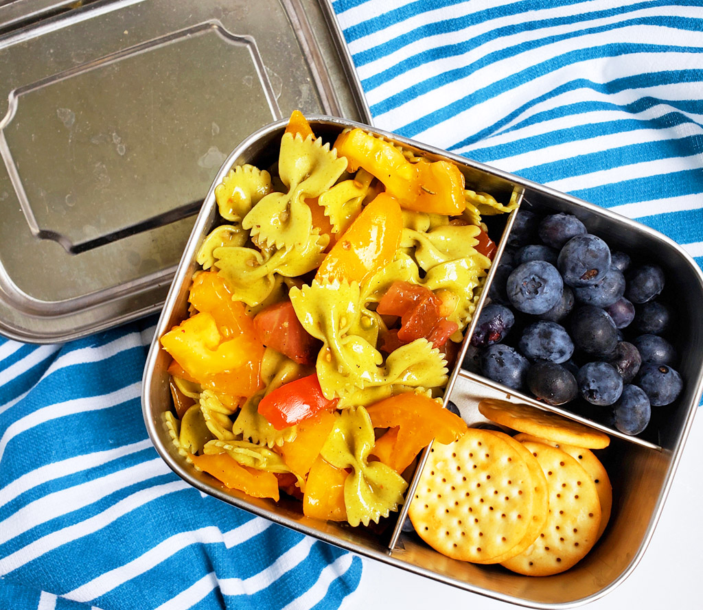 Easy Heirloom Tomato Bow-Tie Pasta in a bento box with blueberries and crackers