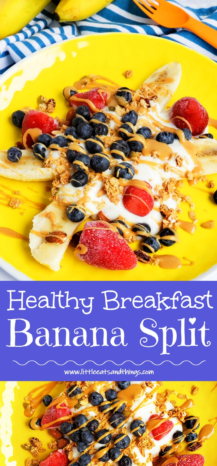 Healthy Breakfast Banana Split, banana sliced in half topped with Greek yogurt, blueberries, strawberries, granola, and peanut butter drizzle on a yellow plate