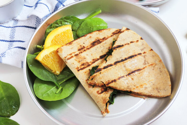 Cheesy Spinach Whole Wheat Quesadillas, grilled on a metal plate