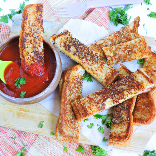 Garlic Toast Grilled Cheese Sticks dipped in marinara sauce