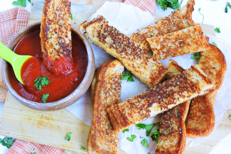 Garlic Toast Grilled Cheese Sticks dipped in marinara sauce