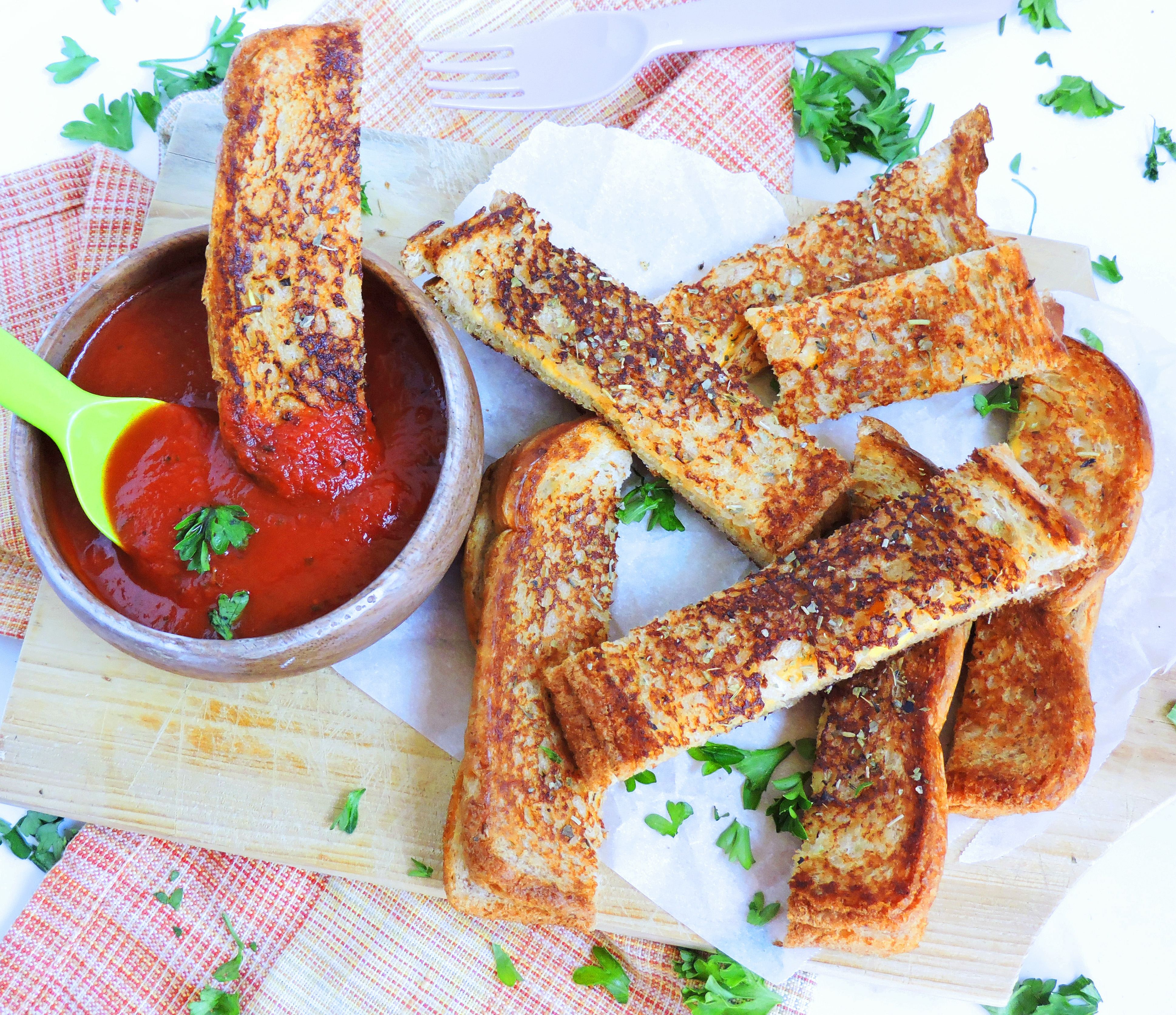 Garlic Toast Grilled Cheese Sticks dipped in marinara sauce