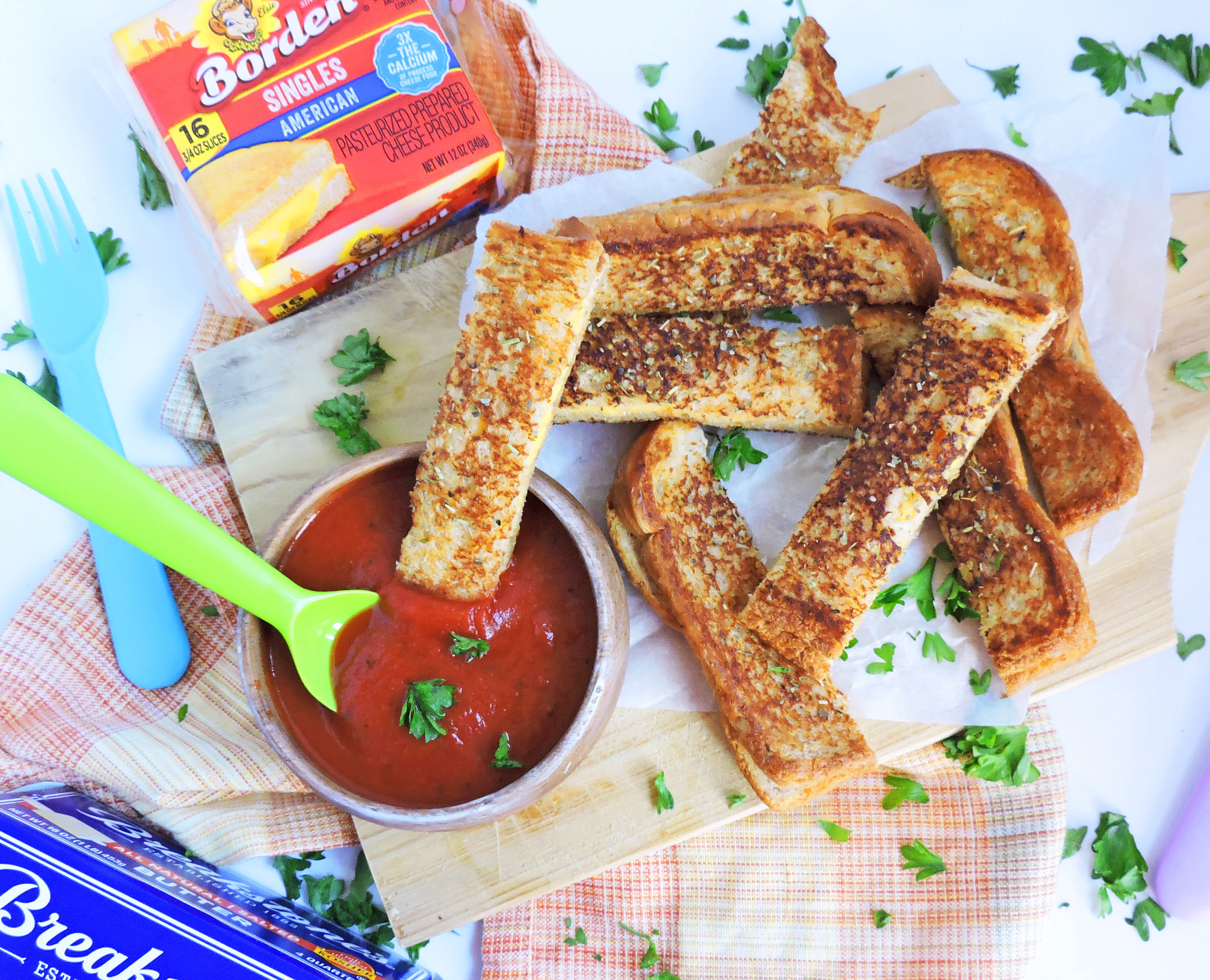 Garlic Toast Grilled Cheese Sticks dipped in marinara sauce