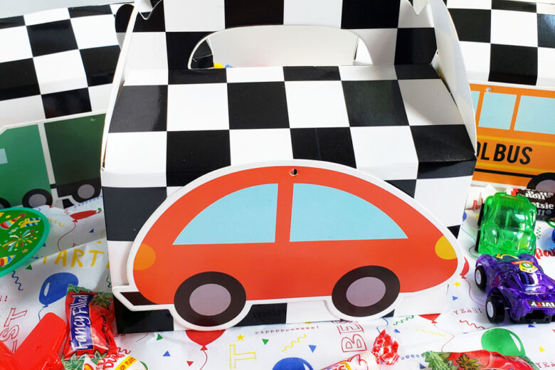 DIY Race Car Party Favor Boxes with black and white checkerboard boxes with cars glued to the front