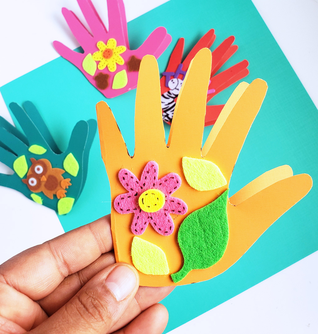 Easy DIY Thanksgiving Cards made with hand prints and stickers on colored craft paper. Perfect for teachers and parents. #thanksgivingcrafts #diythanksgiving