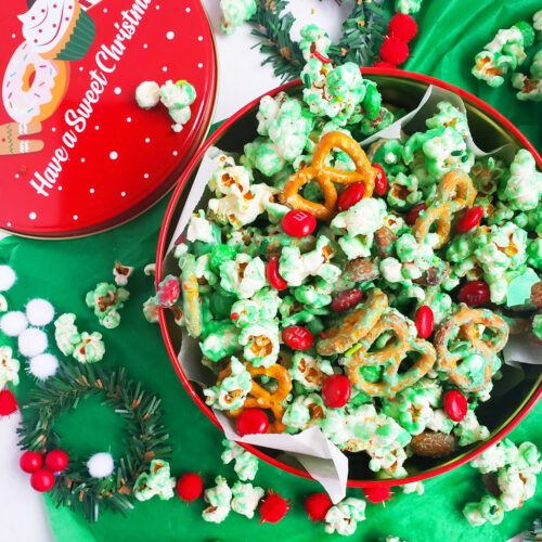 Easy Holiday Grinch Mix made with green white chocolate, almonds, pretzels, and M&Ms