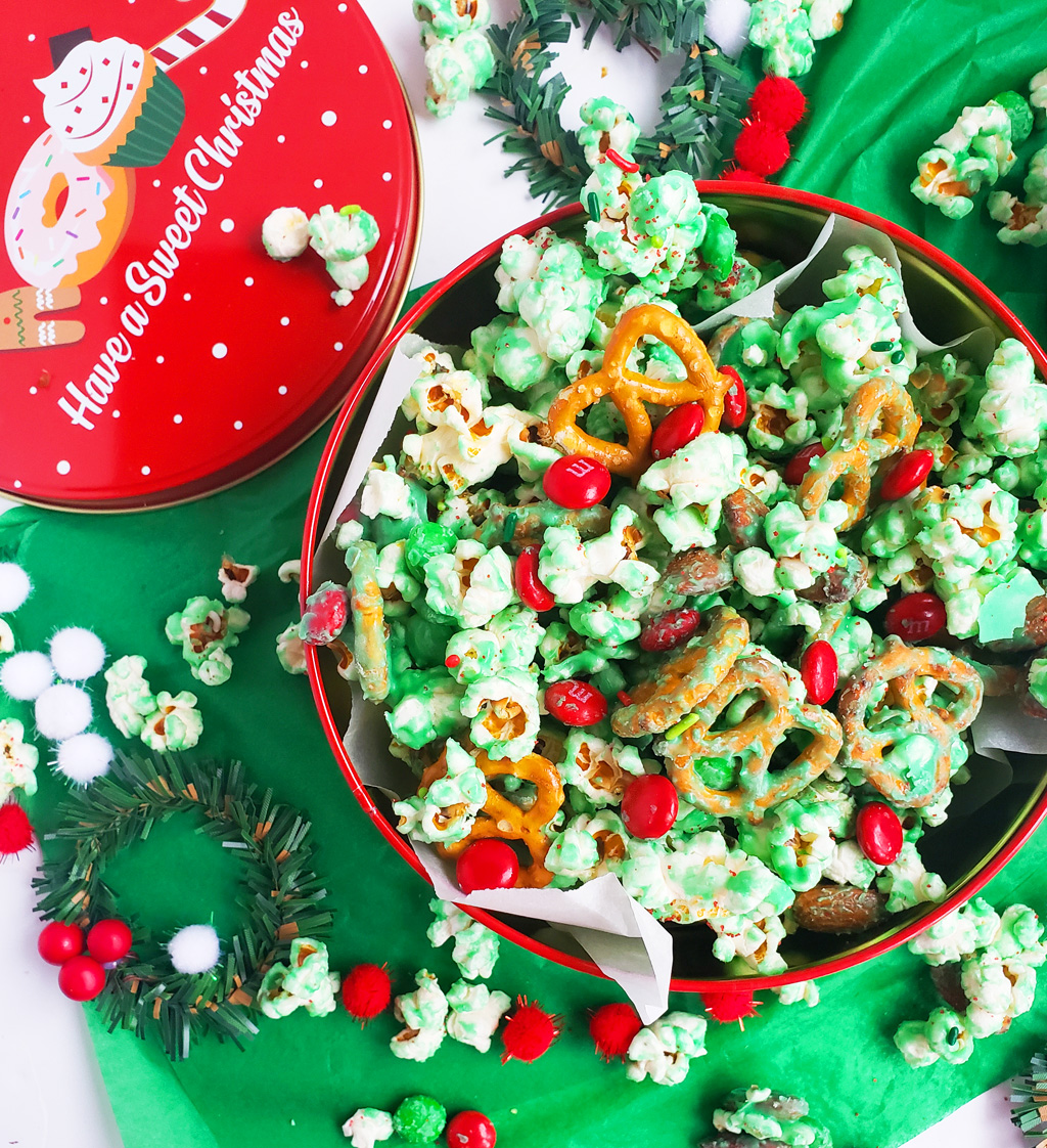 Easy Holiday Grinch Mix made with green white chocolate, almonds, pretzels, and M&Ms