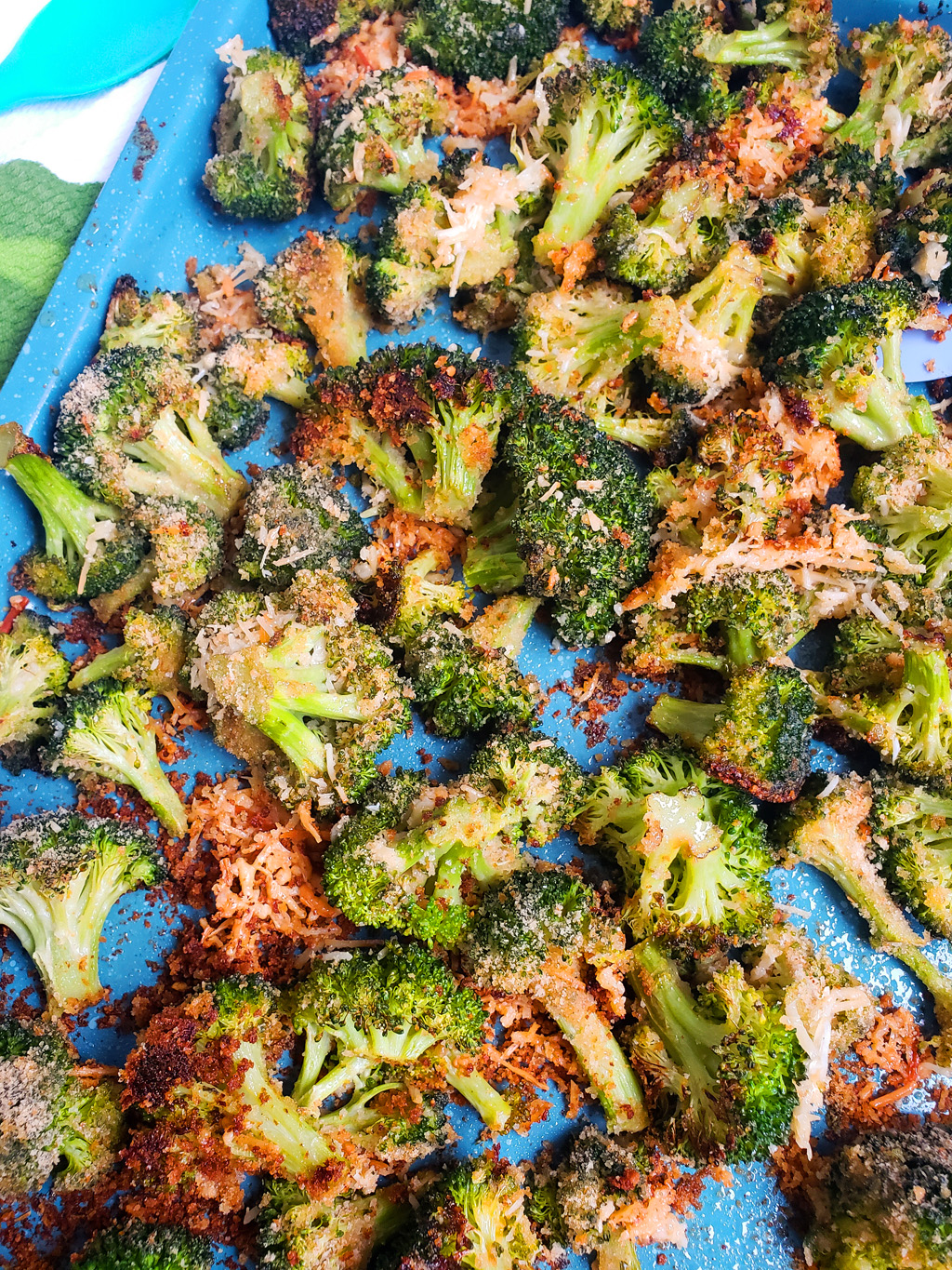 Quick & Easy Parmesan Roasted Broccoli on a blue sheet pan