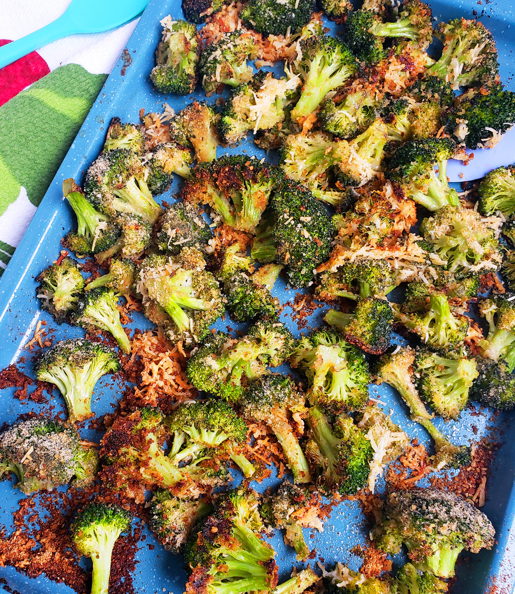 Quick & Easy Parmesan Roasted Broccoli on a blue sheet pan