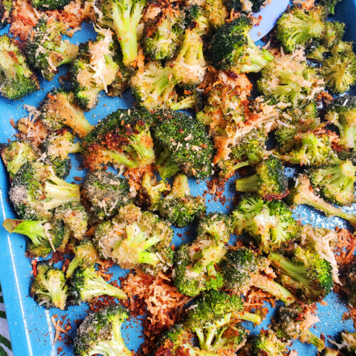 Quick & Easy Parmesan Roasted Broccoli on a blue sheet pan