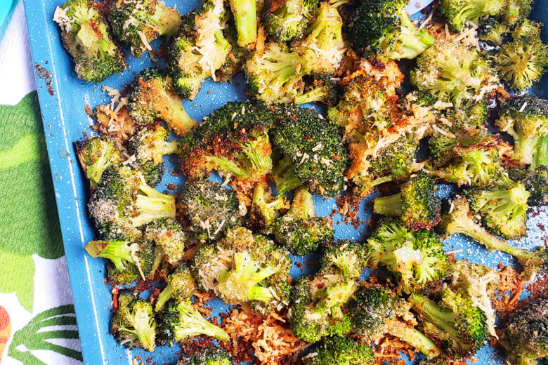 Quick & Easy Parmesan Roasted Broccoli on a blue sheet pan