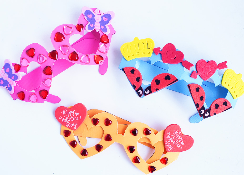 Kids' Valentine's Glasses – Pink, Orange, and Blue Cute Valentine’s Day Glasses. make this printable set of fabulous Heart Glasses. Adorable Kids Valentines idea #printables #valentinesday #valentines #kidsvalentines