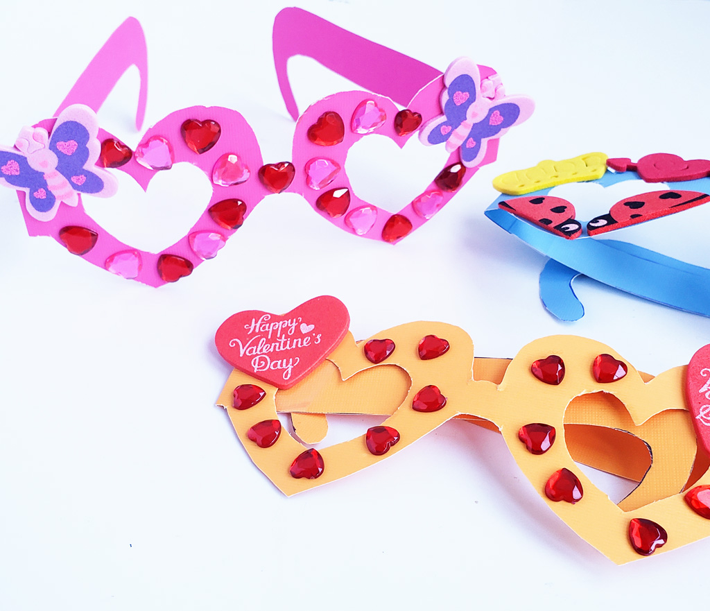 Kids' Valentine's Glasses – Pink, Orange, and Blue Cute Valentine’s Day Glasses. make this printable set of fabulous Heart Glasses. Adorable Kids Valentines idea #printables #valentinesday #valentines #kidsvalentines