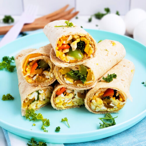 Cheesy Veggie & Egg Breakfast Roll-Ups, the perfect kid-approved, toddler-approved meal. #healthykids #kidsinthekitchen #breakfastwraps