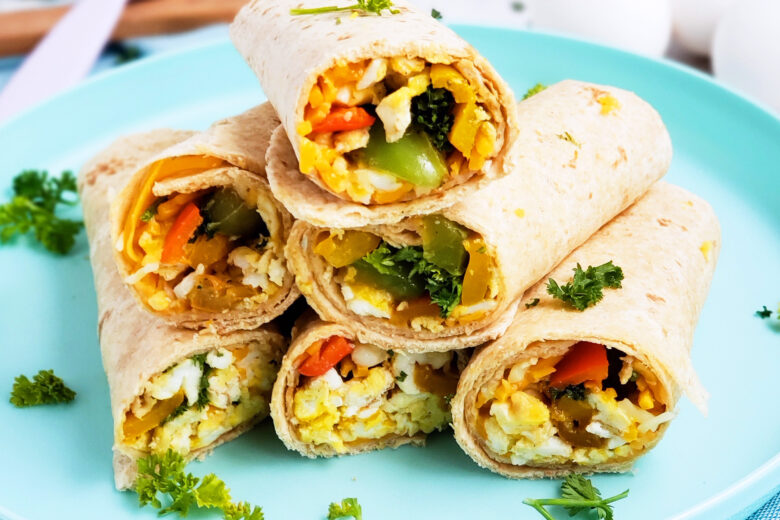 Cheesy Veggie & Egg Breakfast Roll-Ups, the perfect kid-approved, toddler-approved meal. #healthykids #kidsinthekitchen #breakfastwraps