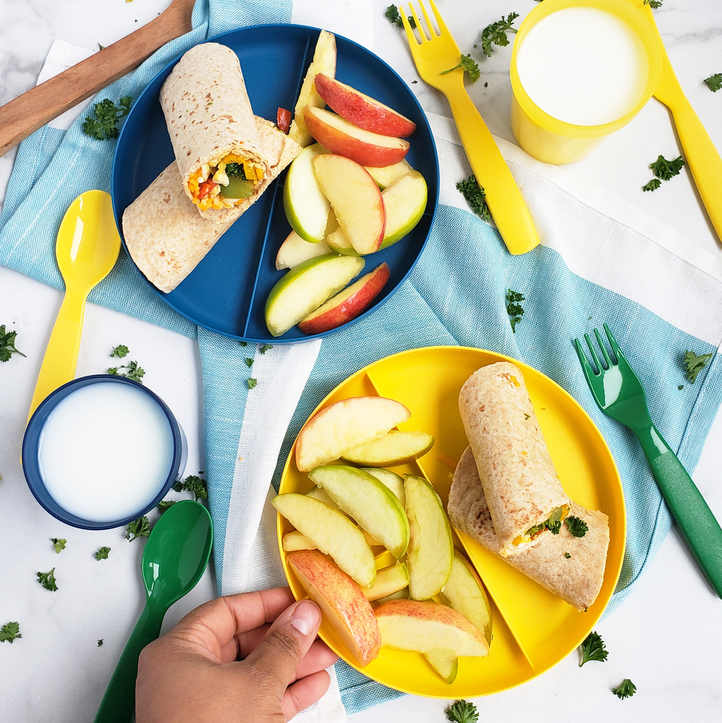 Cheesy Veggie & Egg Breakfast Roll-Ups, the perfect kid-approved, toddler-approved meal. #healthykids #kidsinthekitchen #breakfastwraps