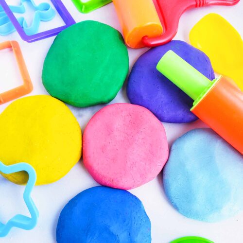 Easy No-Cook DIY Playdough, made with no cream of tartar, and no cooking required. The easiest playdough recipe ever. Different color playdough and utensils. #sensoryactivities #indooractivitiesforkids #indooractivities #homemadeplaydough #playdoh