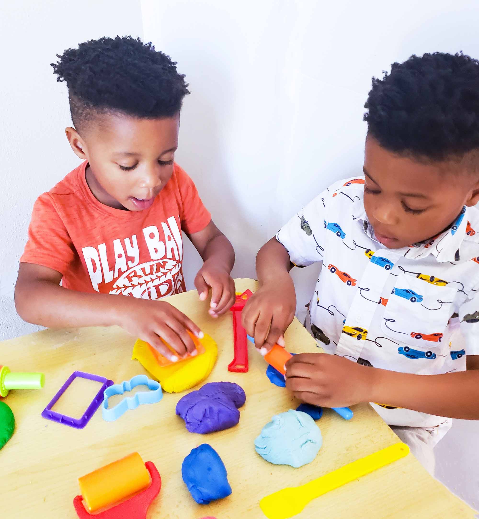 Easy No-Cook DIY Playdough, made with no cream of tartar, and no cooking required. The easiest playdough recipe ever. Different color playdough and utensils. #sensoryactivities #indooractivitiesforkids #indooractivities #homemadeplaydough #playdoh