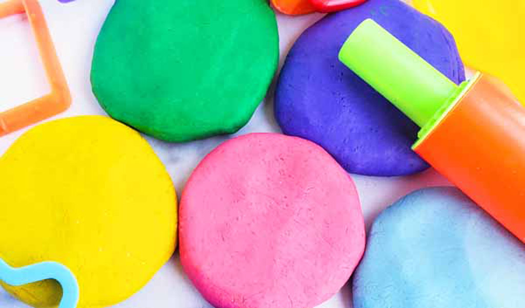 Easy No-Cook DIY Playdough, made with no cream of tartar, and no cooking required. The easiest playdough recipe ever. Different color playdough and utensils. #sensoryactivities #indooractivitiesforkids #indooractivities #homemadeplaydough #playdoh