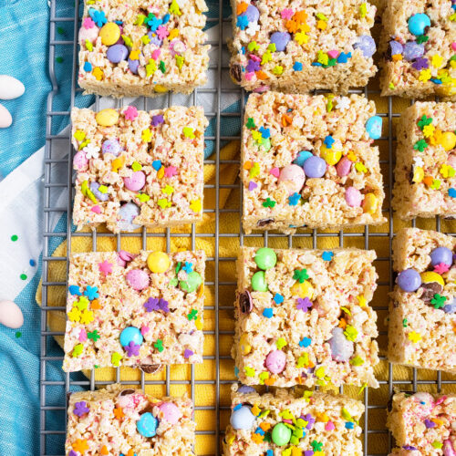 The Best Easter Rice Krispies Treats made with M&Ms, Cadbury eggs, and sprinkles. Cut into squares on a wire rack. The perfect Spring treat