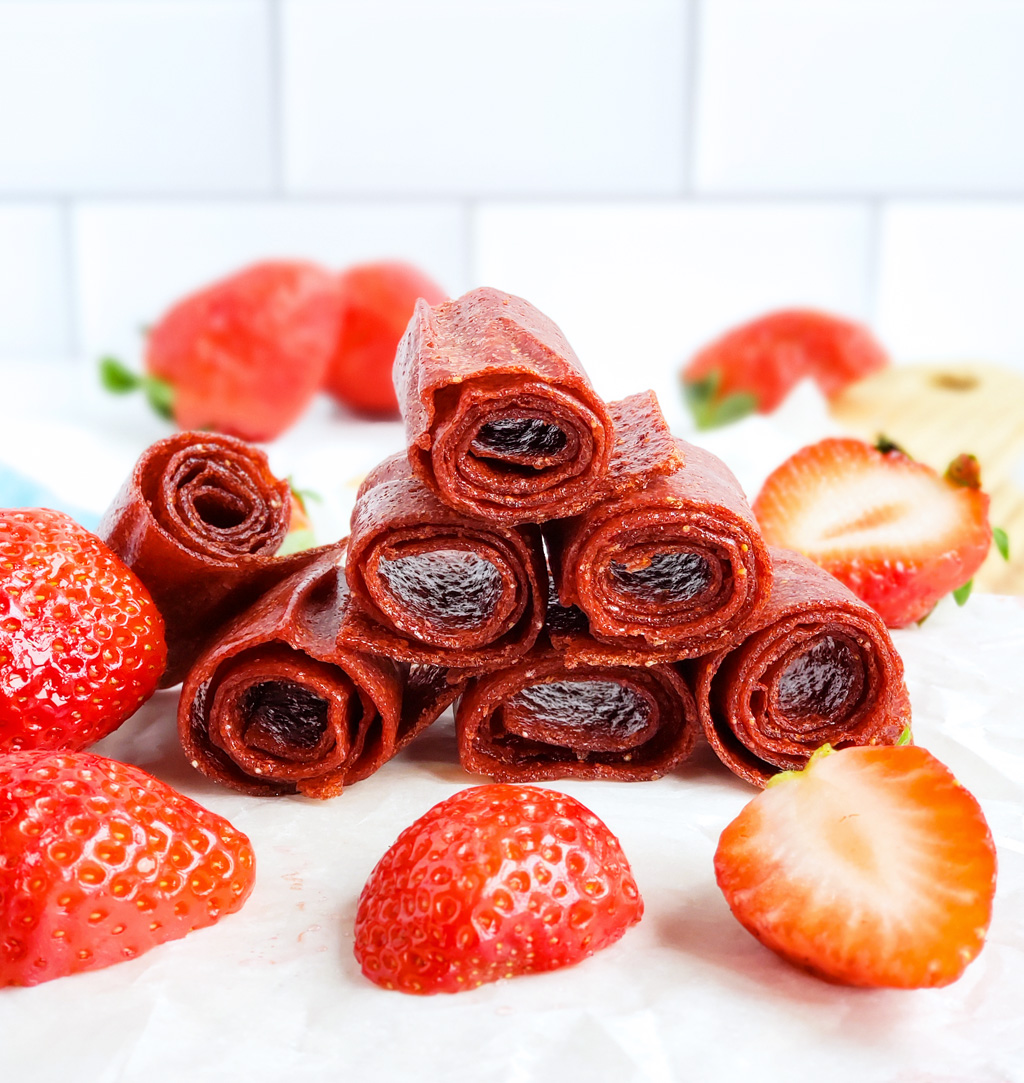 These 3-Ingredient Homemade Strawberry Fruit Roll-Ups are such an easy, healthy, and delicious way to make your very own fruit leather…. without any fancy equipment! Easy Healthy Strawberry Fruit Snacks. #fruitleather #strawberryfruitsnacks #fruitrollup #healthysnacksforkids littleeatsandthings.com 