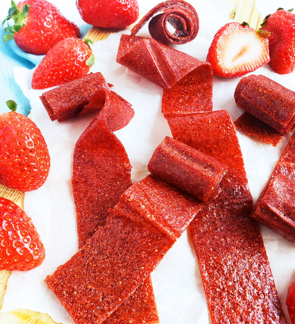 These 3-Ingredient Homemade Strawberry Fruit Roll-Ups are such an easy, healthy, and delicious way to make your very own fruit leather…. without any fancy equipment! Easy Healthy Strawberry Fruit Snacks. #fruitleather #strawberryfruitsnacks #fruitrollup #healthysnacksforkids littleeatsandthings.com 