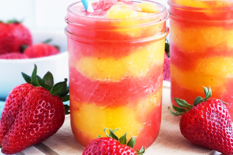 Fresh Mango Strawberry Swirled Slushies. Summer is almost here, so let’s celebrate with these Fresh Mango Strawberry Swirled Slushies, made with fresh mangos (mangoes) and strawberries, and sweetened with a touch of honey. #slush #slushies #fruitslushies #frozentreats #healthytreatsforkids #kidapproved littleeatsandthings.com