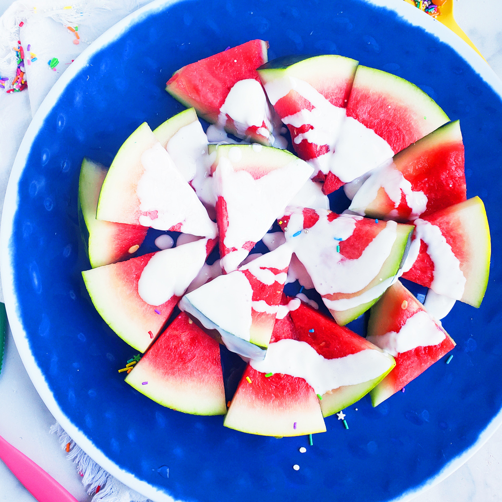 Fun & Easy Sweet Watermelon Nachos made with vanilla Greek yogurt, honey, and sprinkles. The perfect summer treat, also great for the 4th of July. Littleeatsandthings.com