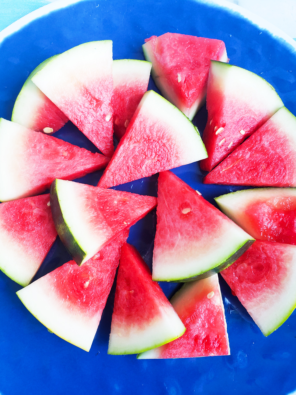 Fun & Easy Sweet Watermelon Nachos made with vanilla Greek yogurt, honey, and sprinkles. The perfect summer treat, also great for the 4th of July. Littleeatsandthings.com