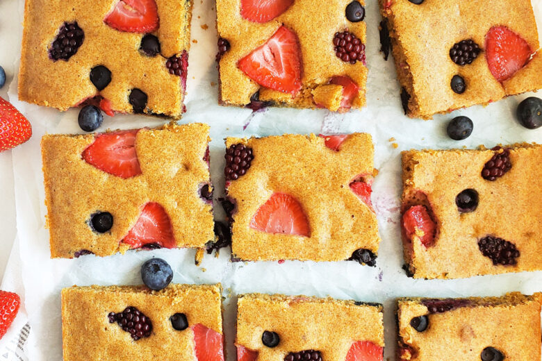 These Very Berry Sheet-Pan Pancakes are an easy, wholesome breakfast that the whole family will enjoy! Made with whole wheat flour, strawberries, blueberries, and raspberries. Littleeatsandthings.com