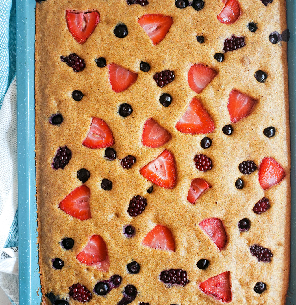 These Very Berry Sheet-Pan Pancakes are an easy, wholesome breakfast that the whole family will enjoy! Made with whole wheat flour, strawberries, blueberries, and raspberries. Littleeatsandthings.com