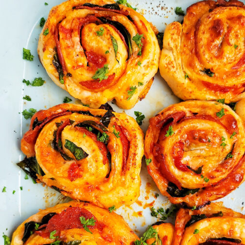 These Spinach & Pepperoni Pizza Rolls are filled with so much flavor and cheesy goodness; made with premade pizza dough. beautifuleatsandthings.com