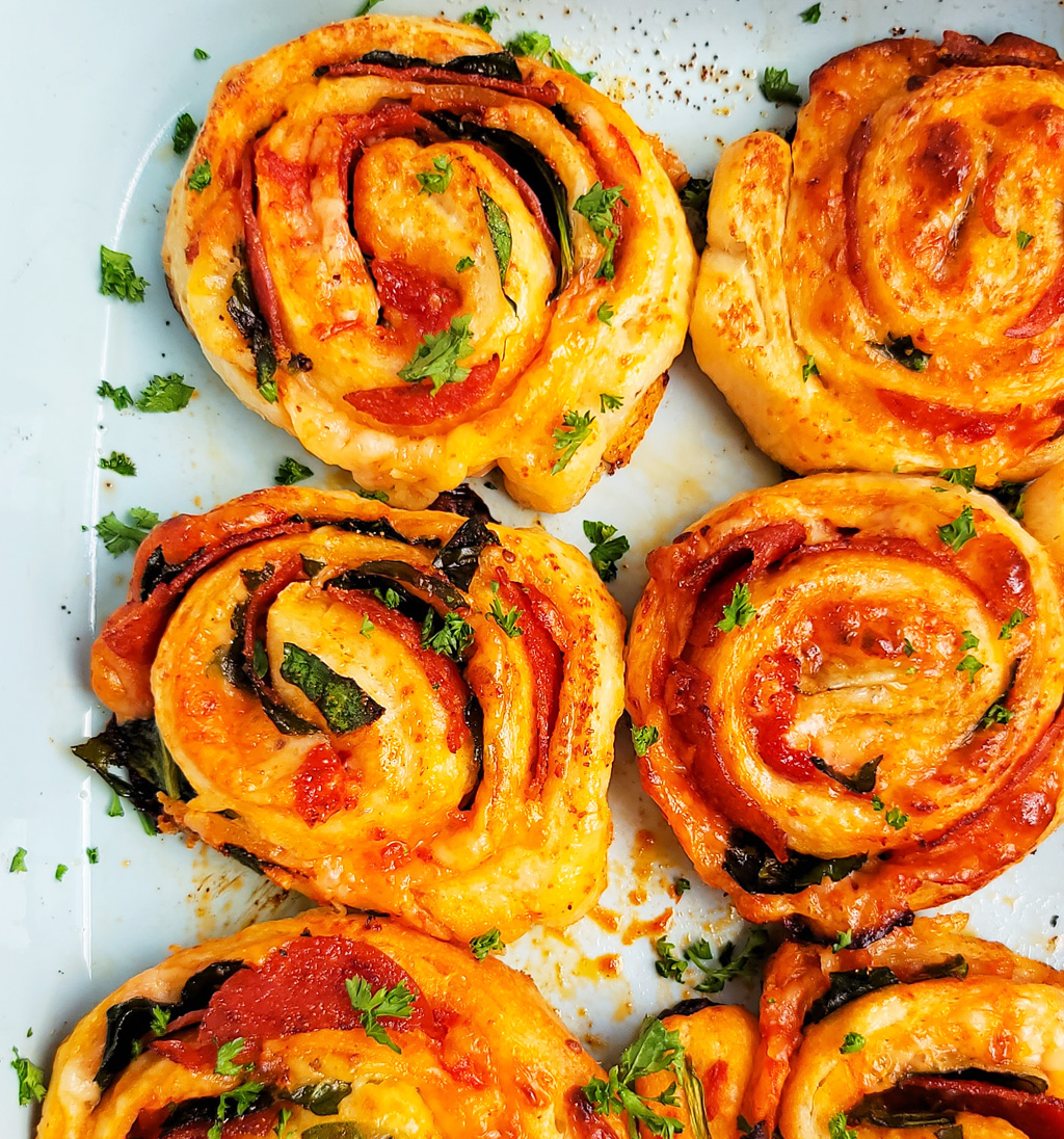 These Spinach & Pepperoni Pizza Rolls are filled with so much flavor and cheesy goodness; made with premade pizza dough. beautifuleatsandthings.com