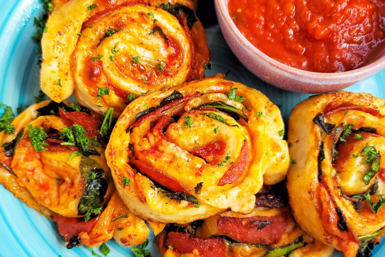 These Spinach & Pepperoni Pizza Rolls are filled with so much flavor and cheesy goodness; made with premade pizza dough. beautifuleatsandthings.com