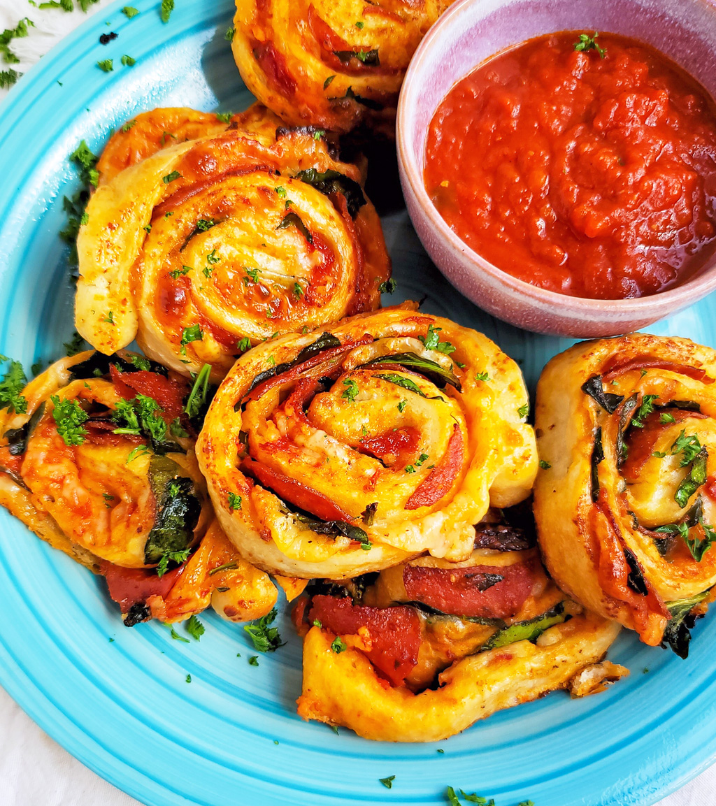 These Spinach & Pepperoni Pizza Rolls are filled with so much flavor and cheesy goodness; made with premade pizza dough. beautifuleatsandthings.com