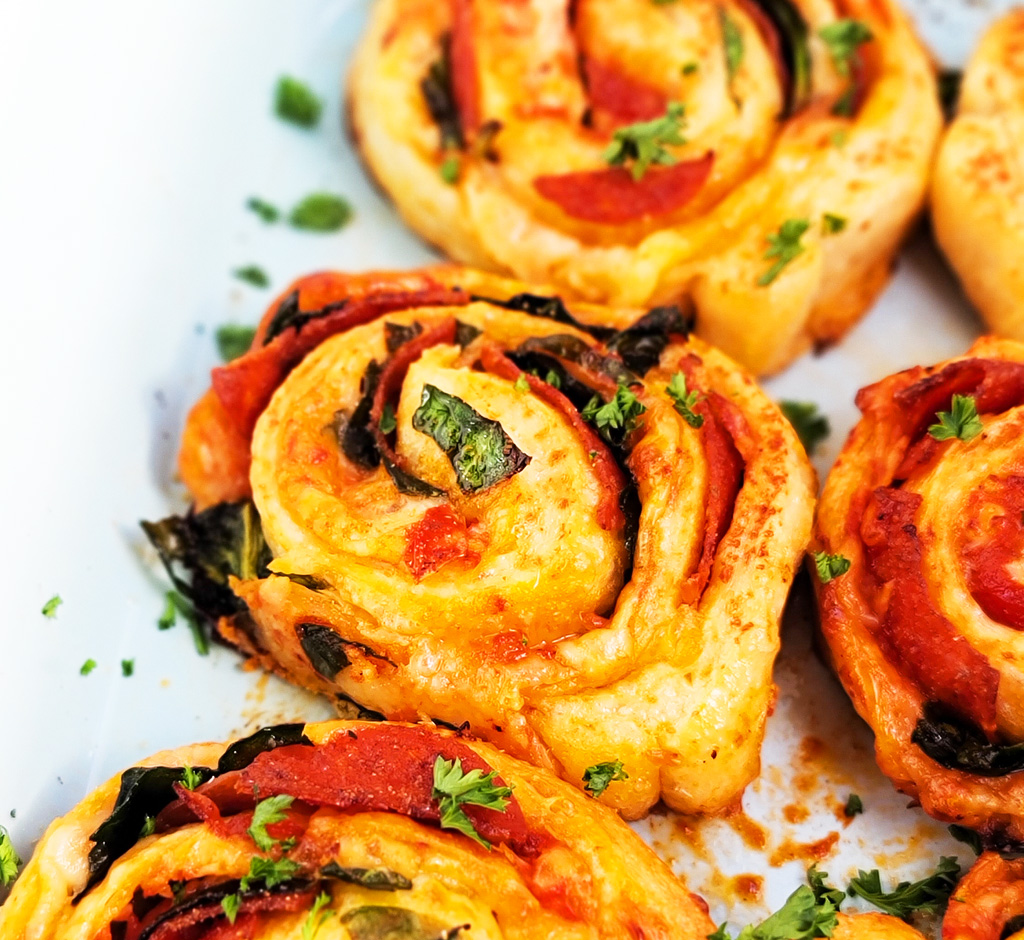 These Spinach & Pepperoni Pizza Rolls are filled with so much flavor and cheesy goodness; made with premade pizza dough. beautifuleatsandthings.com