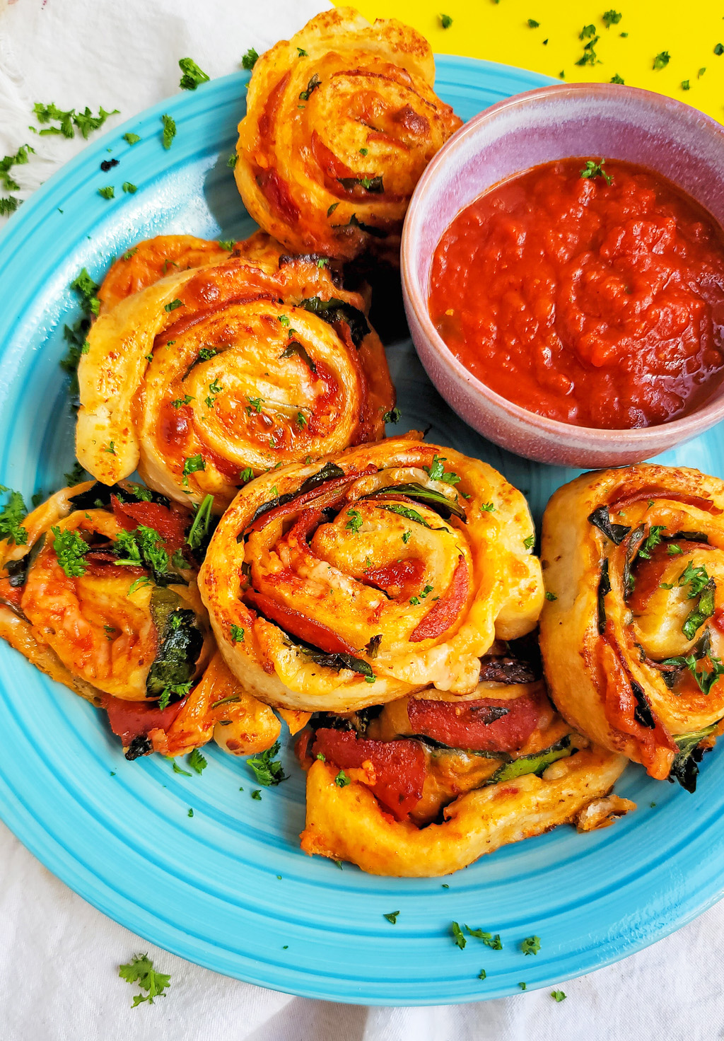 These Spinach & Pepperoni Pizza Rolls are filled with so much flavor and cheesy goodness; made with premade pizza dough. beautifuleatsandthings.com