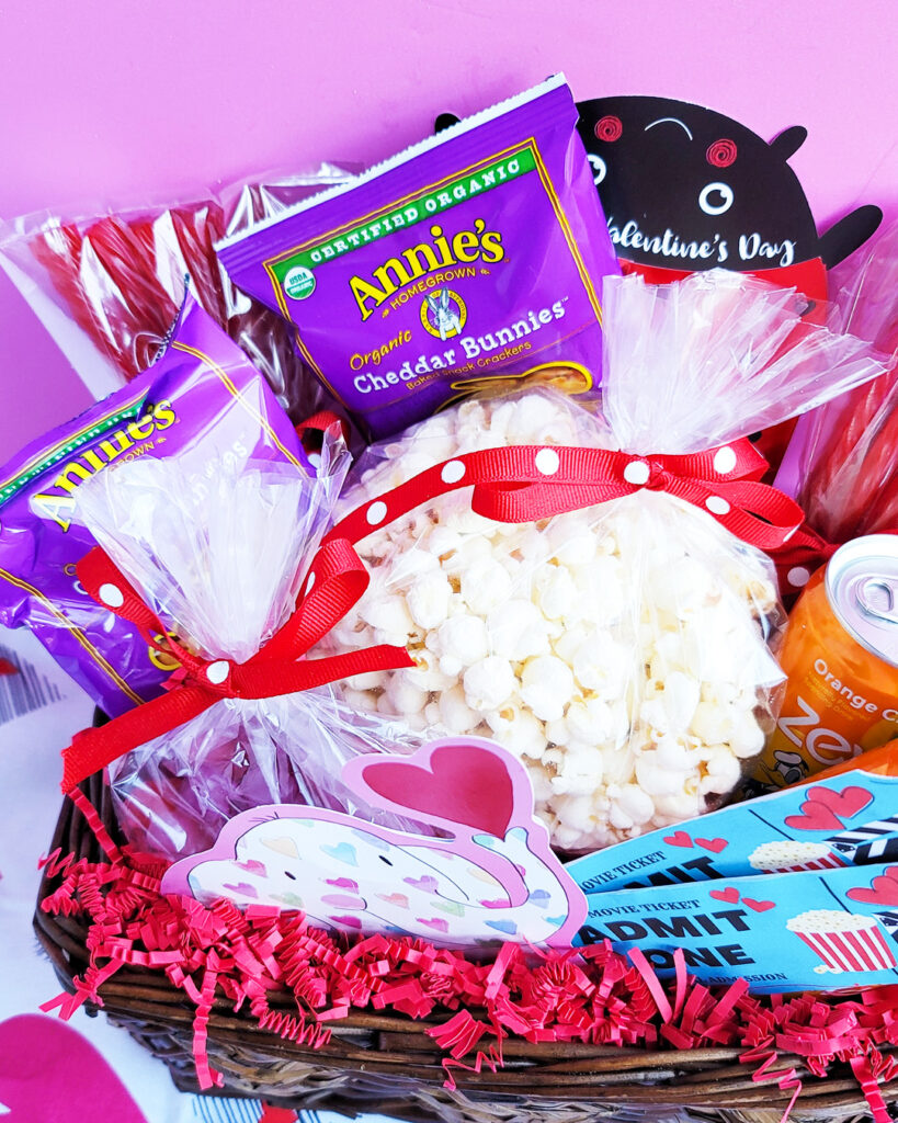 Surprise the kids with this exciting Movie Themed Valentine’s Day Basket! This basket contains popcorn, candy, and a Free DIY Printable for Movie Tickets. littleeatsandthings.com