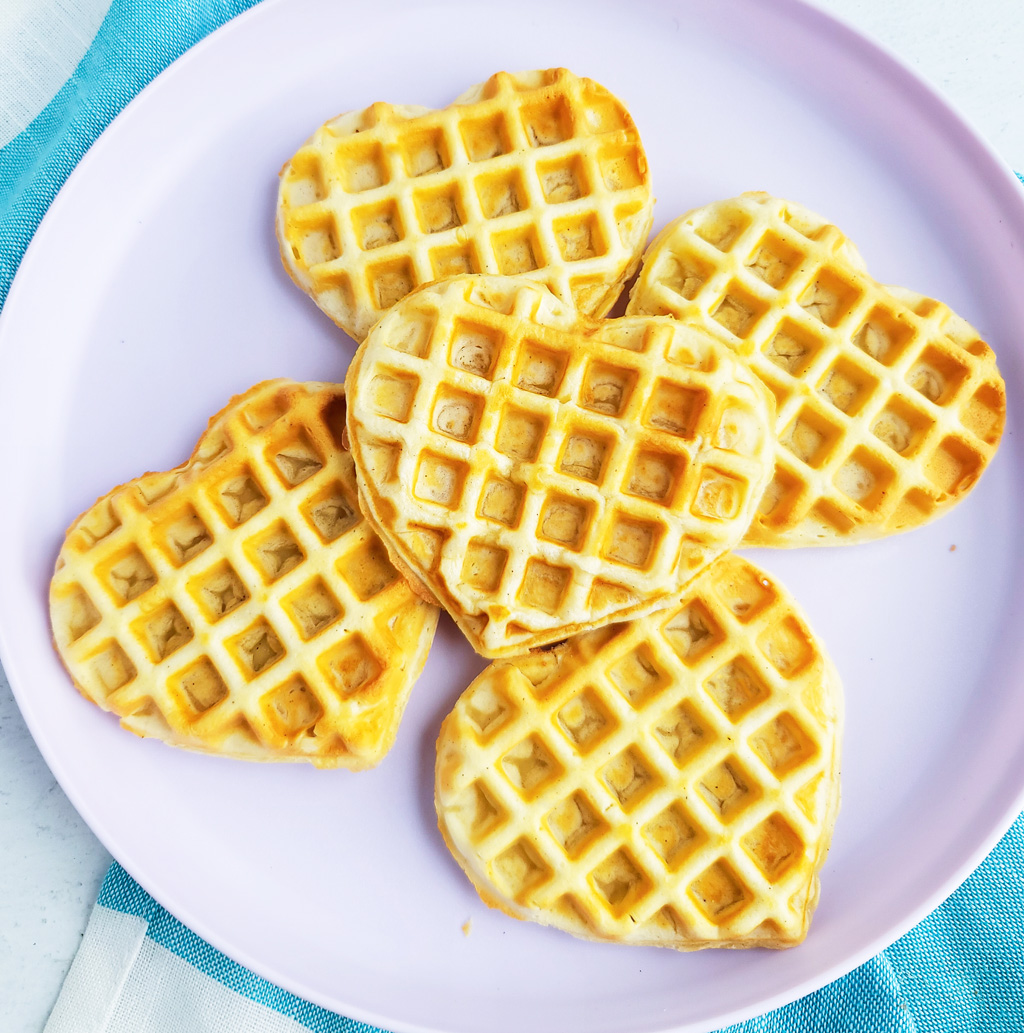 These Berry Yummy Mini Heart Waffles make the perfect Valentine’s Day breakfast! So light and airy… and topped with delicious blueberries and strawberries.