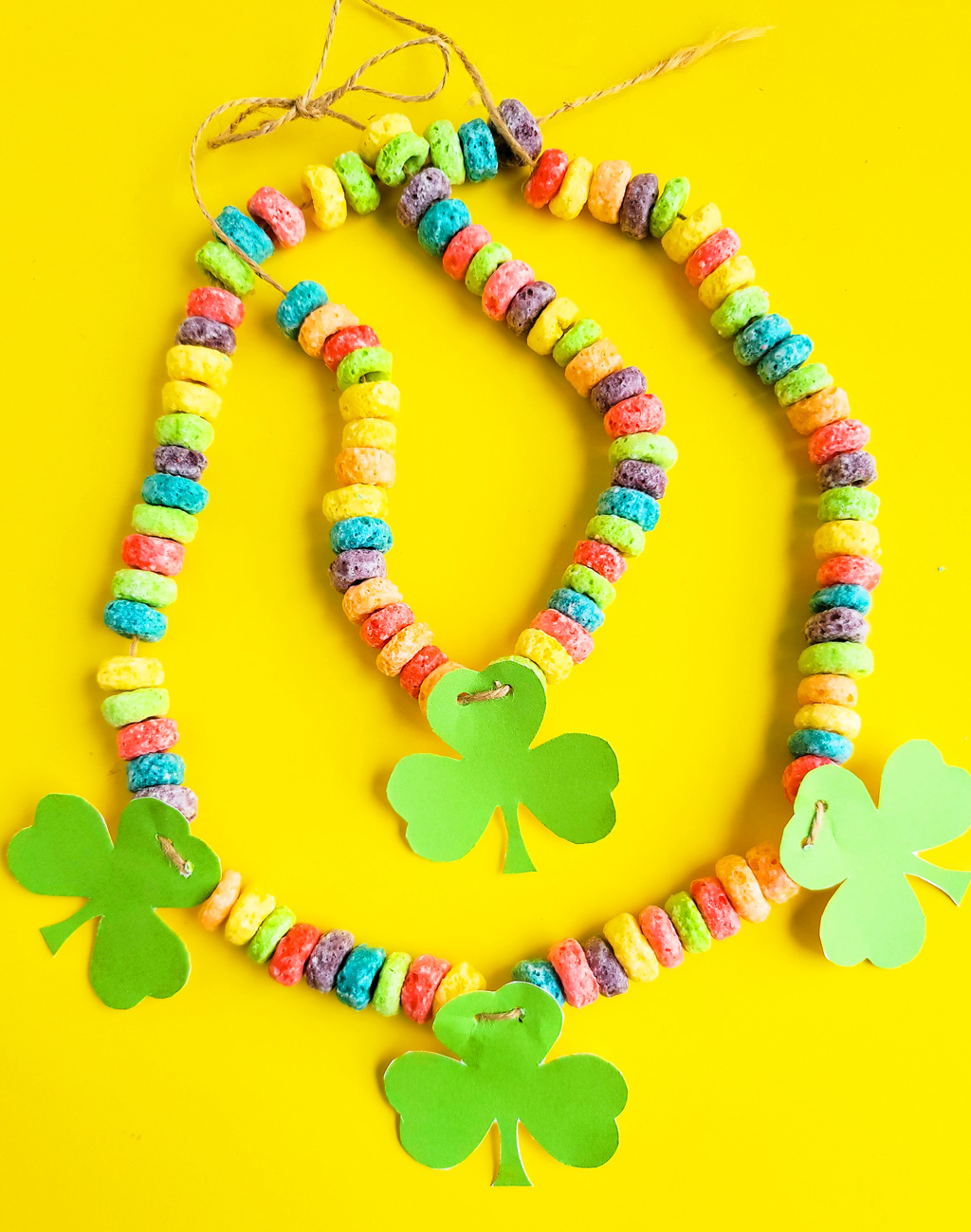 I’ve got you covered with this simple, fun craft: DIY St. Patrick's Day Shamrock Necklace made with fruit loops!  Plus FREE St. Patrick's Day printables.  beautifuleatsandthings.com