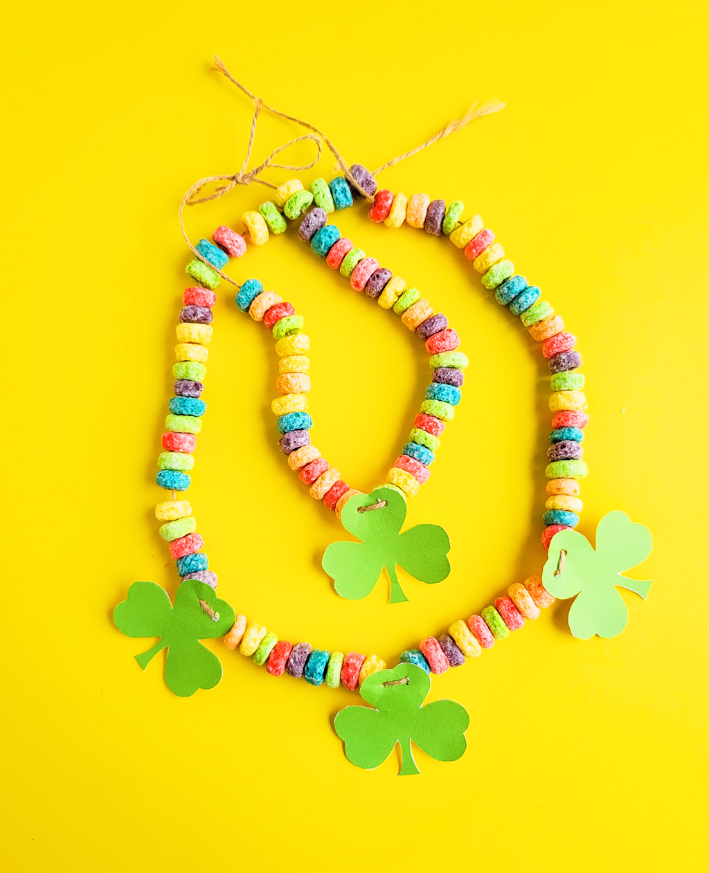 I’ve got you covered with this simple, fun craft: DIY St. Patrick's Day Shamrock Necklace made with fruit loops!  Plus FREE St. Patrick's Day printables.  beautifuleatsandthings.com