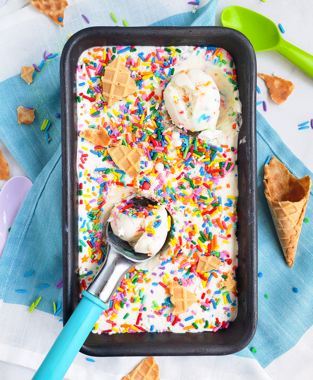 Beat the heat with this delicious, cool No Churn Confetti Ice Cream. Funfetti No Churn Ice Cream made with 3 ingredients in a loaf pan with sprinkles on top. littleeatsandthings.com 