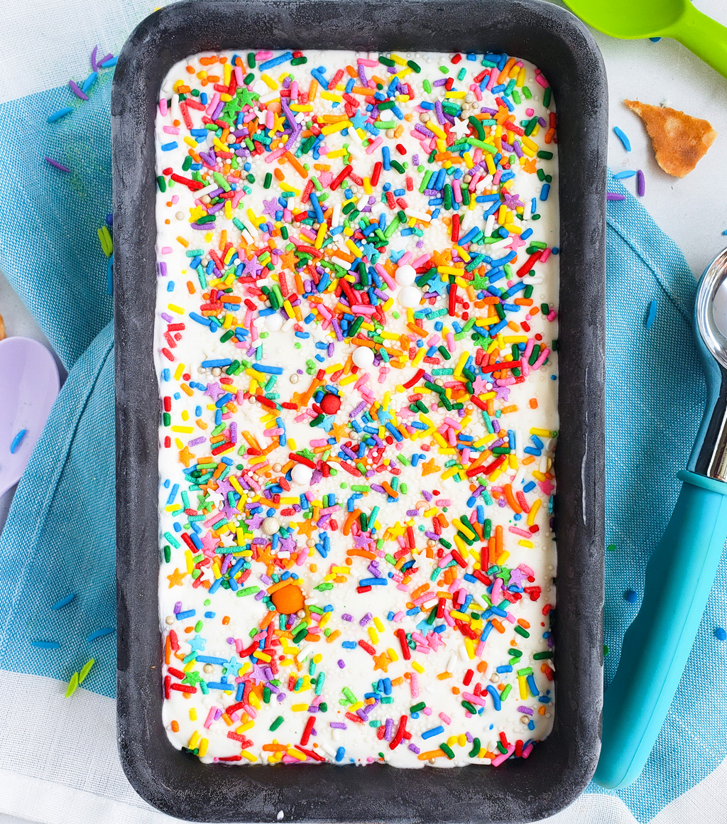 Beat the heat with this delicious, cool No Churn Confetti Ice Cream. Funfetti No Churn Ice Cream made with 3 ingredients in a loaf pan with sprinkles on top. littleeatsandthings.com 