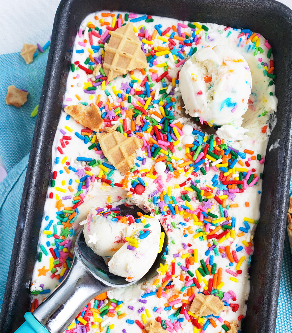 Beat the heat with this delicious, cool No Churn Confetti Ice Cream. Funfetti No Churn Ice Cream made with 3 ingredients in a loaf pan with sprinkles on top. littleeatsandthings.com 