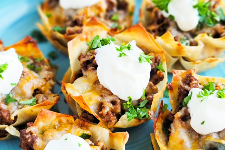 Easy Cheesy Taco Cups! Perfect for Taco Tuesday made with wontons, taco meat, sour cream. beautifuleatsandthings.com