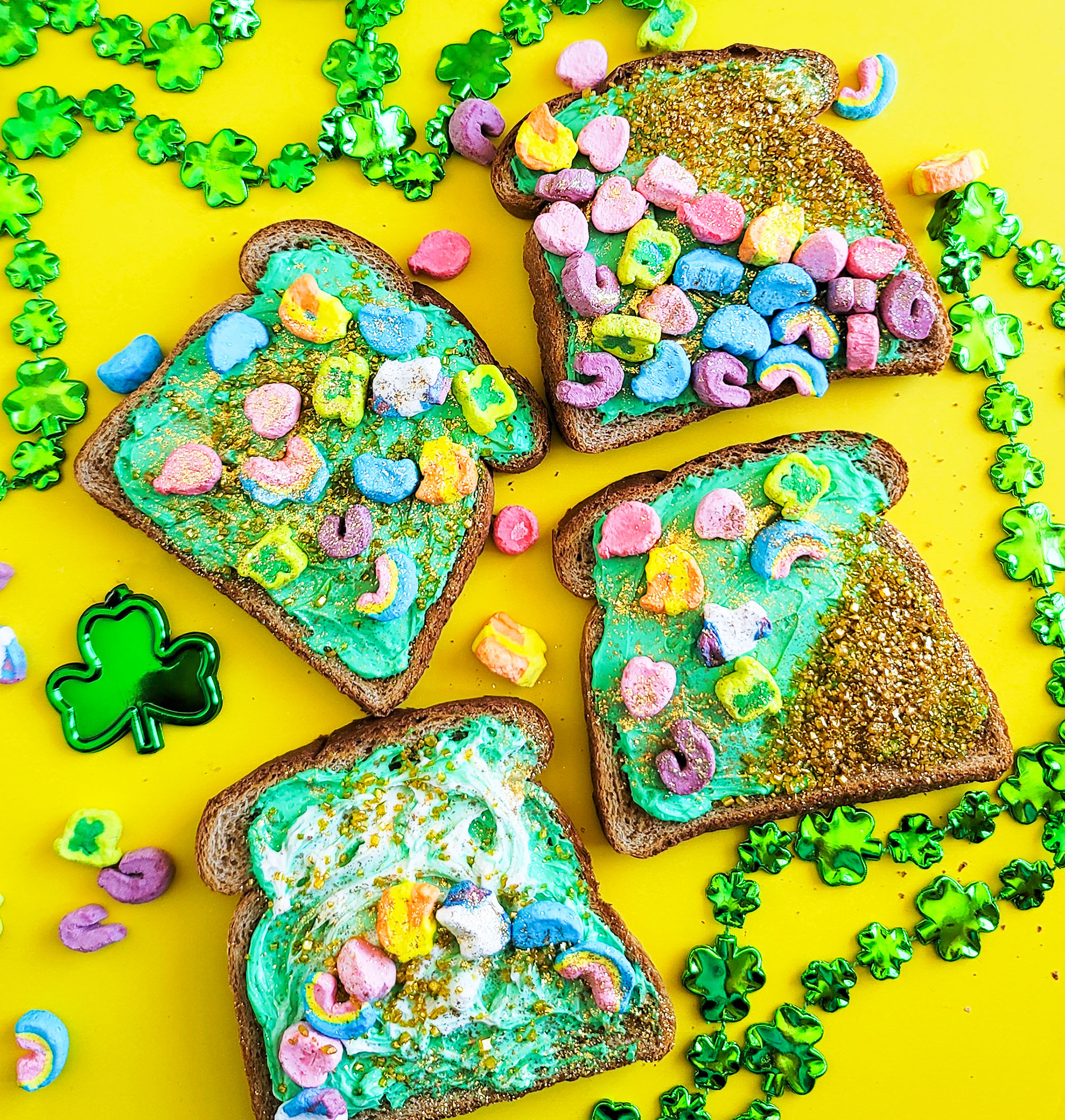 St. Patrick’s Day Leprechaun Toast with lucky charms cereal marshmallows, gold sprinkles, and edible glitter littleeatsandthings.com