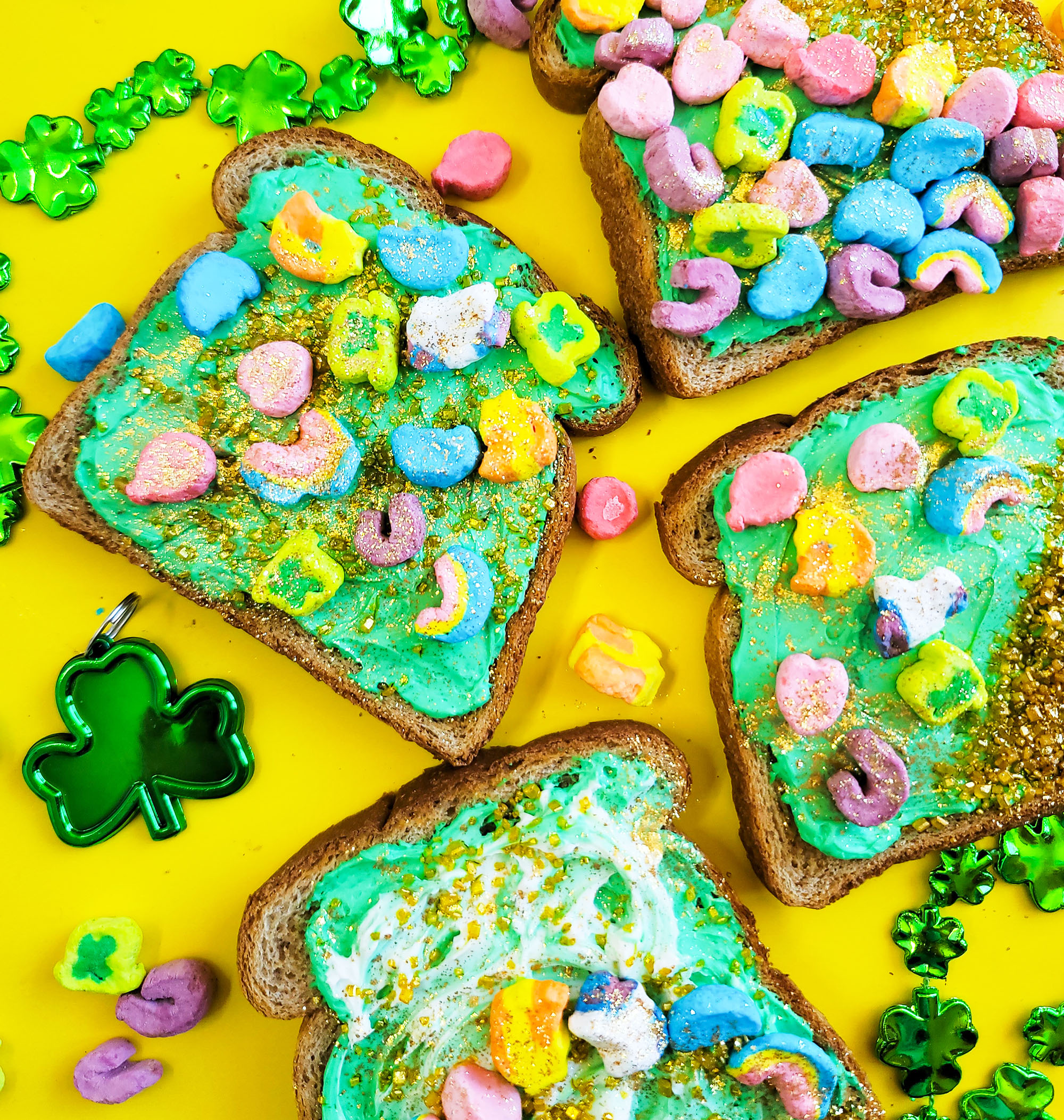 St. Patrick’s Day Leprechaun Toast with lucky charms cereal marshmallows, gold sprinkles, and edible glitter littleeatsandthings.com