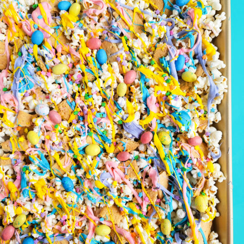 Easy Easter Popcorn with White Chocolate & Mini Eggs, purple, yellow, pink, and blue white chocolate beautifuleatsandthings.com