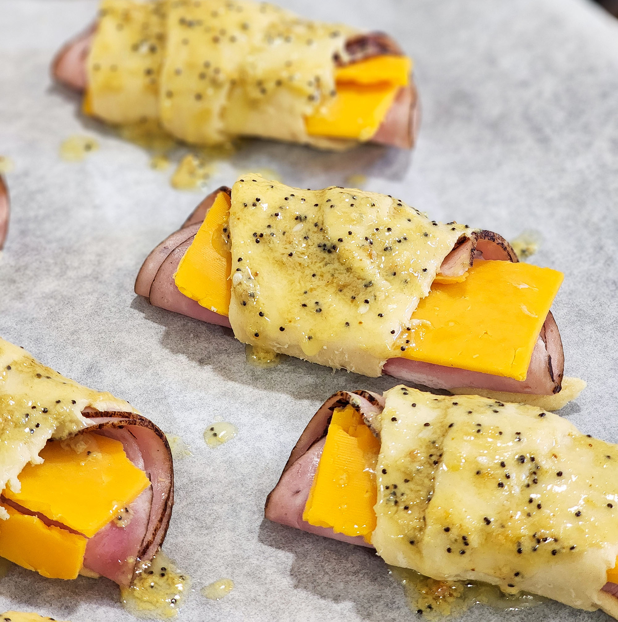 Ham & Cheese Crescent Roll Ups on a silver plate  littleeatsandthings.com